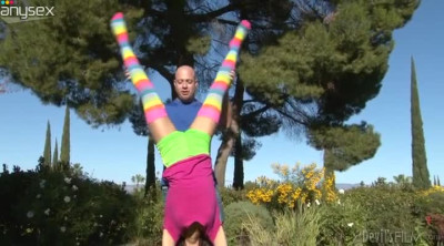 Leggy teen in colorful stockings gives her head outdoor