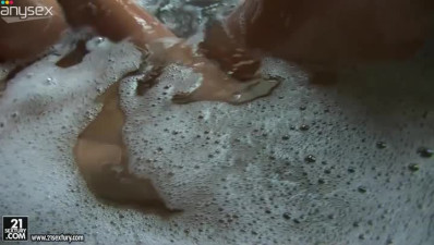 Epic brunette actress Aletta Ocean enjoys bath tub by the window